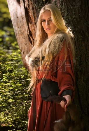 15264844-scandinavian-girl-with-runic-signs-holding-a-fur-skins